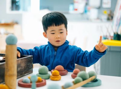 Child playing with balls.